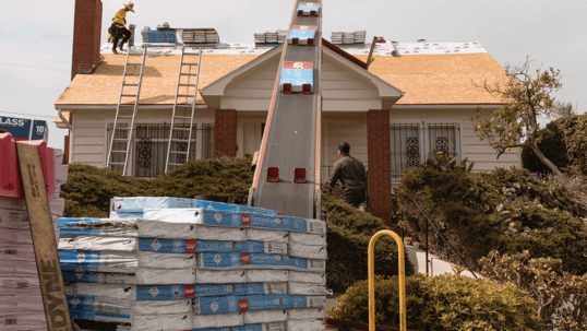 ABC truck conveying up GAF shingles to the roof