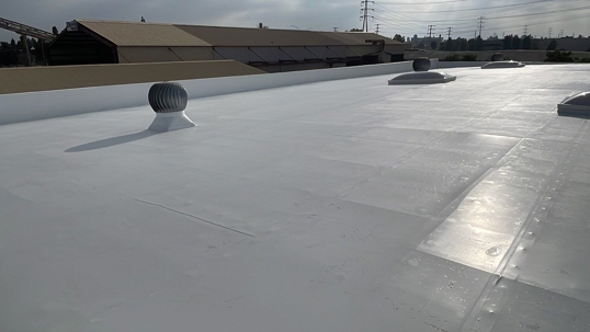 Finished IB Roof Systems 50 mil white PVC cool roof with Lane-Aire skylights at Avatar Machine in Fountain Valley
