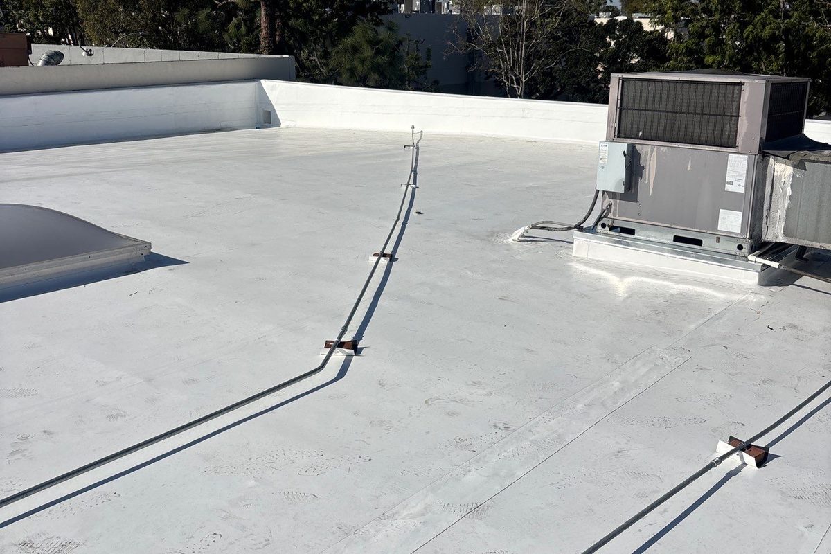 Finished white PVC roof with welded seams on a Long Beach commercial building